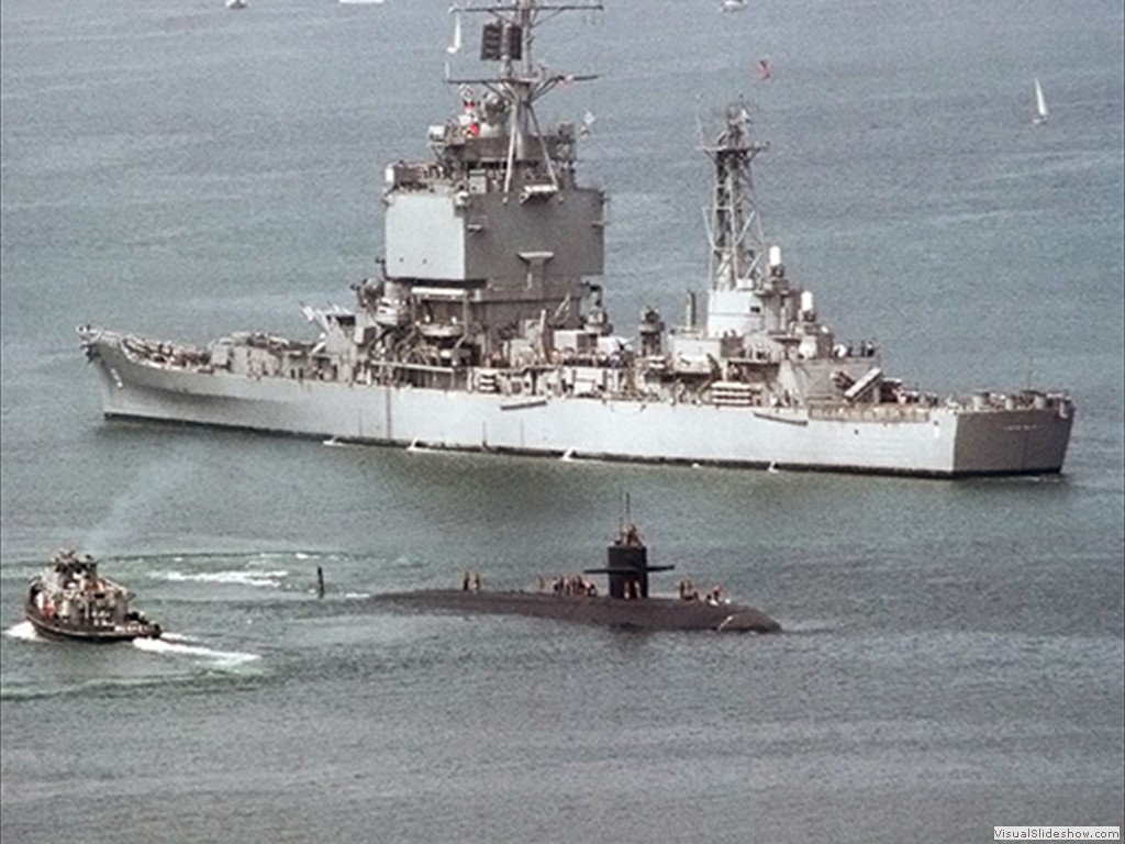 USS La Jolla (SSN-701) passes the USS Long Beach (CGN-9) 1982.