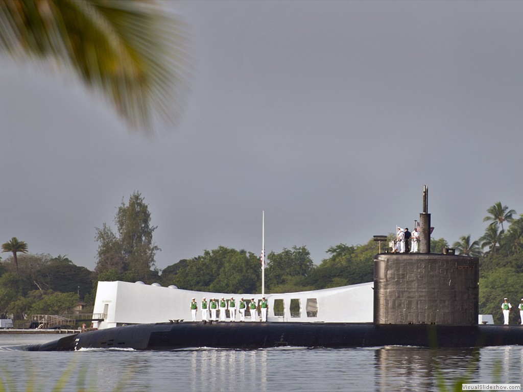 USS Tucson (SSN-770) passes the USS Arizona Memorial